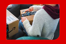 a woman opening an amazon package