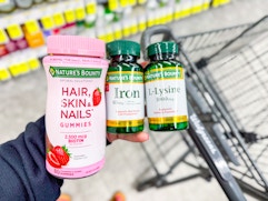 hand holding nature's bounty products in walgreens