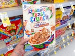 hand holding cinnamon toast crunch cereal in walgreens