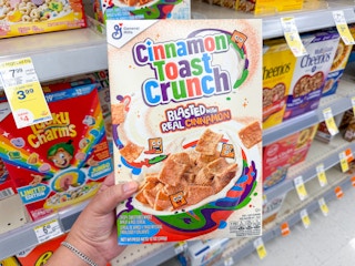 hand holding cinnamon toast crunch cereal in walgreens