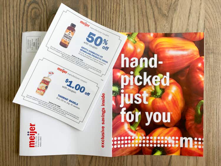 A coupon mailer from Meijer with a coupon for Thomas bagels and a coupon for Kombucha.
