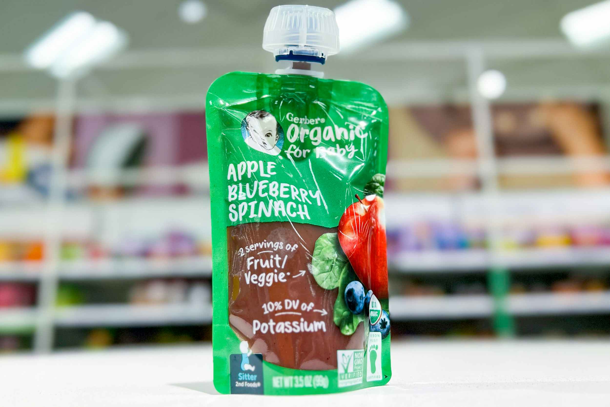a pouch of gerber baby apple blueberry spinach