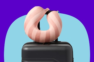 open story memory foam neck pillow wrapped around a suitcase