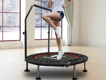 a person jumping on a mini trampoline 