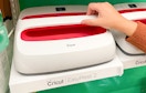 a hand on a Cricut EasyPress 2 machine