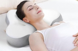 a woman wearing a cervical neck pillow