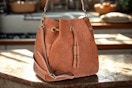 brown bucket bag
