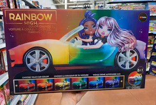hand holding rainbow high color change car at walmart