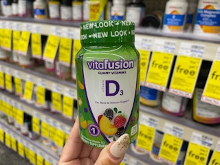 vitafusion d3 gummies being held in CVS aisle