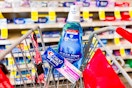 crest toothpaste and mouthwash in a cart
