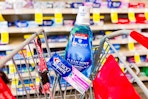 crest toothpaste and mouthwash in a cart