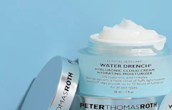 a light blue jar of face moisturizer