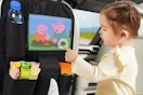 a girl playing with a peppa pig screen