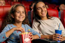 a woman and her daughter at a movie