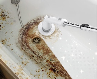 electric scrubber cleaning a bathtub