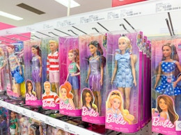 barbie dolls sitting on a target shelf