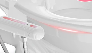 a bidet on a toilet