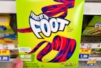 hand holding a box of general mills fruit snacks