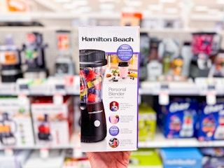 Hamilton Beach Single-Serve Blender held up in front of small kitchen appliances at Target