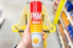 hand holding a bottle of pam cooking spray