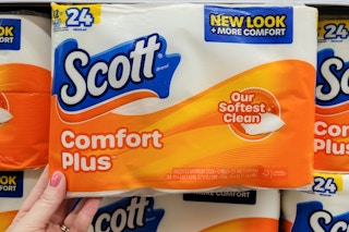 hand holding package of scott comfort plus toilet paper at kroger