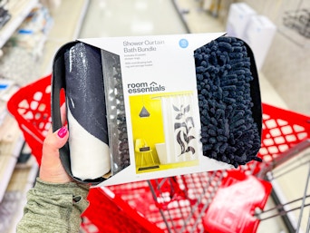 hand holding a target bath bundle set over a cart