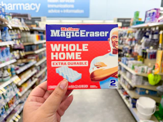 hand holding mr. clean magic erasers in walgreens