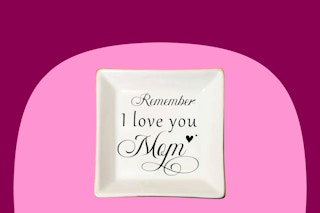 A small square off-white ceramic tray that says, "Remember I love you Mom," in black script