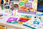 Crayola paintings on kids' desk