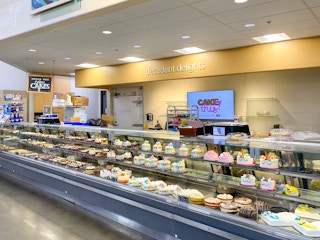 cupcakes and desserts in hy-vee grocery store bakery department display