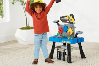 a child playing with the Pretend Play Workbench