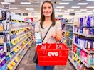 woman holding iphone and cvs shopping basket