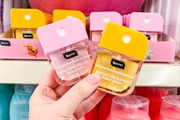 hand holding b-pure hand sanitizers at dollar tree