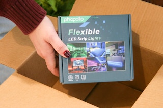 flexible led strip lights being held out of box