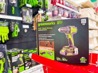 greenworks drill sitting on a target cart
