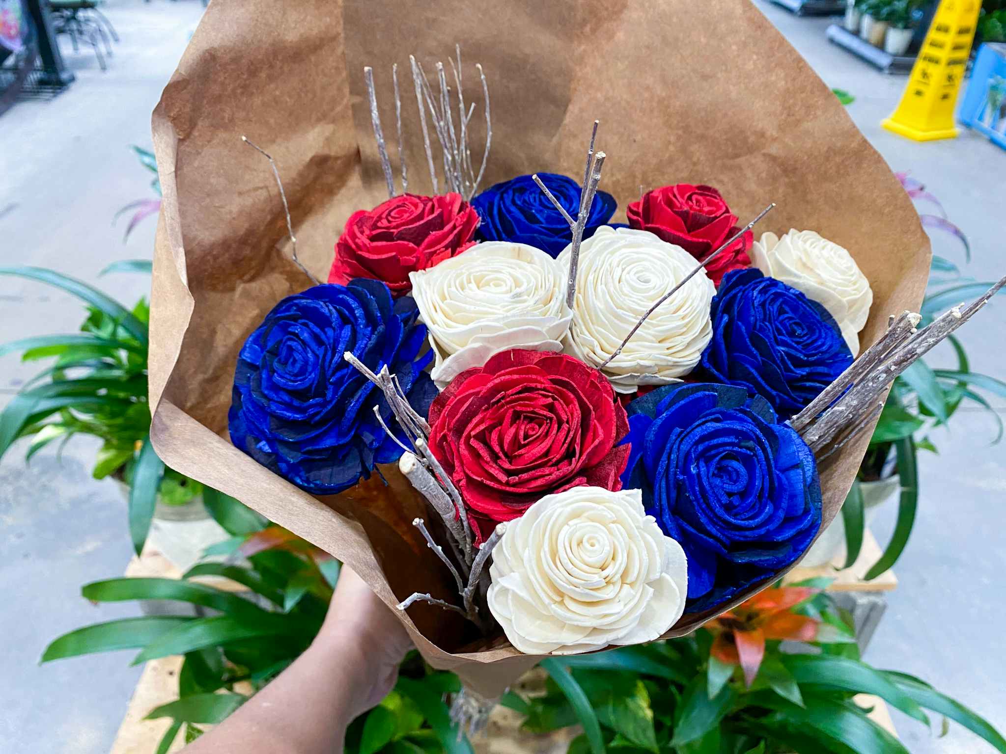 hand holding memorial day bouquet at lowes