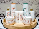 8 Dove Holiday Treats products on wooden tray with marble background