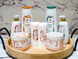 8 Dove Holiday Treats products on wooden tray with marble background