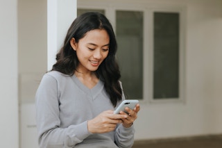 Woman looking down at phone