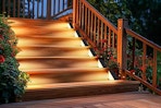 Lifestyle image of the Nordic Solar Light set of 8 used on deck stairs