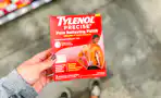hand holding tylenol precise pain relief patch
