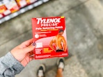 hand holding tylenol precise pain relief patch