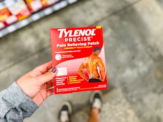 hand holding tylenol precise pain relief patch