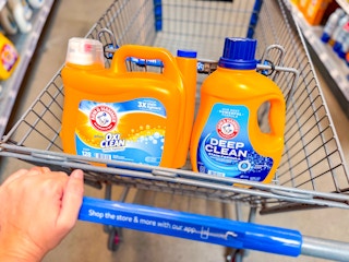 Two Arm & Hammer laundry detergents in Walmart shopping cart