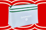 White Garnier makeup bag with green stripe and Target logo, on a red background