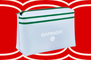 White Garnier makeup bag with green stripe and Target logo, on a red background