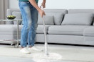 person using spin scrubber on floor
