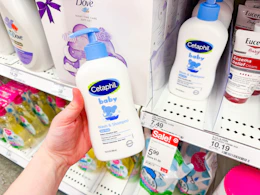 holding a bottle of cetaphil baby wash & shampoo in front of a target shelf