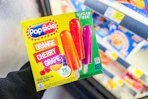 hand holding a box of popsicles