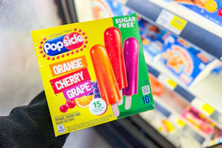 hand holding a box of popsicles